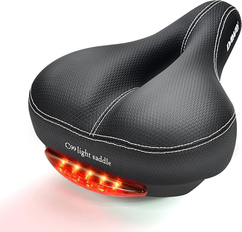 Daway C99 – Sillín de bicicleta, unisex, cómodo con asiento ancho de piel, para bicicleta de montaña con luz trasera, suspensión, suave, espuma acolchada, resistente al agua, compatible con la mayoría de bicicletas
